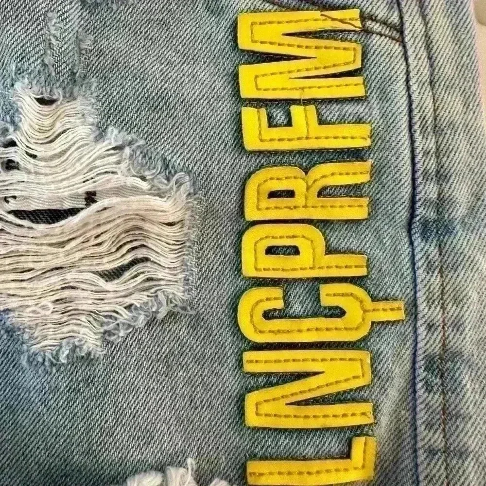 LANCA PERFUME NWOT Raw Hem High Ride W/Yellow Leather Logo Stitched On Sz 38/7